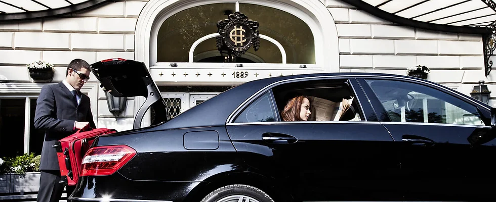 women sitting in the backseat of a car