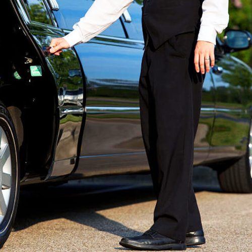 man holding chauffeur door