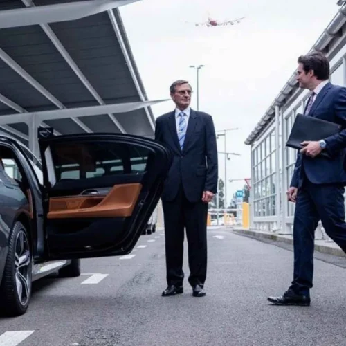travel-from-airport couple coming towards car